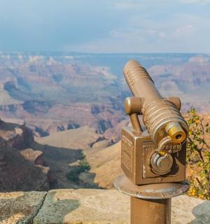 a camera on the edge of a canyon
