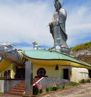 a statue of a woman on top of a building