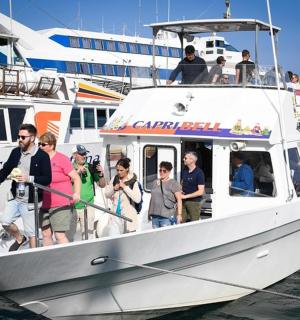 a group of people on a boat in the water