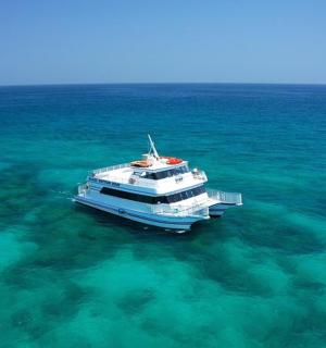 a boat in the middle of the ocean