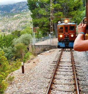 a person taking a picture of a train