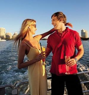 a man and a woman standing on a boat