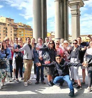a large group of people standing in front of a building