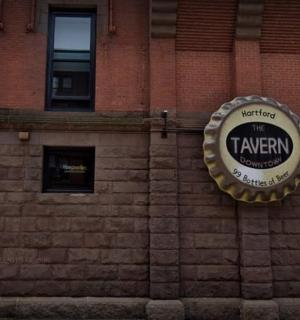 a sign on the side of a brick building