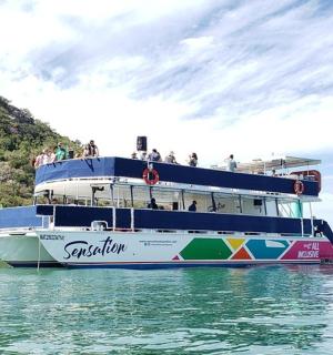 a boat with people on it in the water