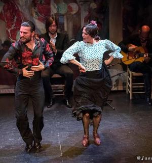 a man and a woman dancing on the stage