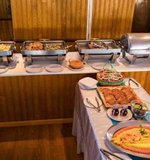 a buffet line with many different types of food