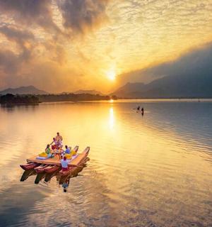 a group of people in a boat on a lake