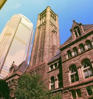 a building with a clock tower in front of buildings