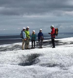 a group of people standing on top of the snow