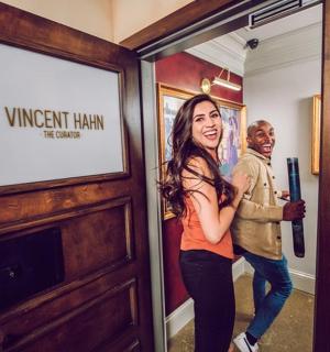 a man and a woman standing in front of a door