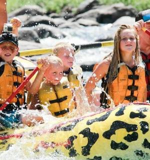 a group of people on a raft in the water