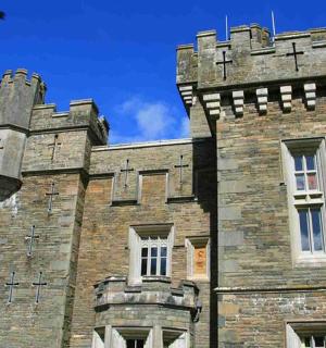 an old castle with a tower on top of it