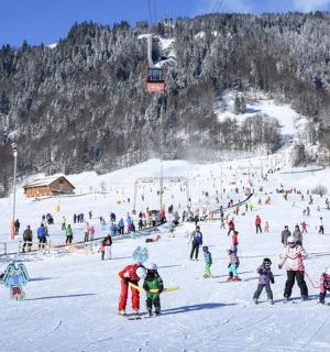 a large group of people on a ski slope
