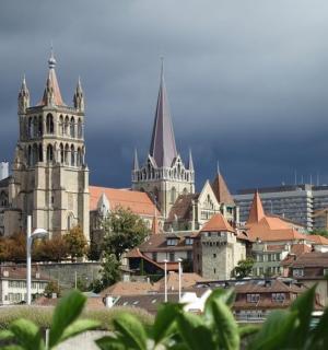 a city skyline with a cathedral and buildings