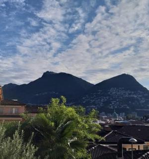 a view of a mountain range with houses and buildings