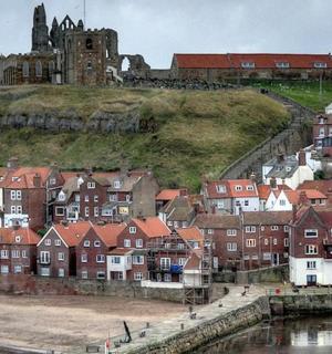 a town with a castle on top of a hill