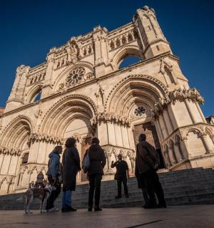 a group of people standing in front of a building