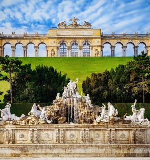 a fountain in front of a large building