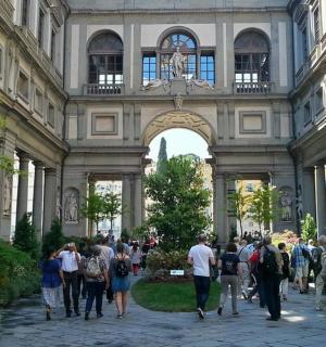 a group of people walking in a building