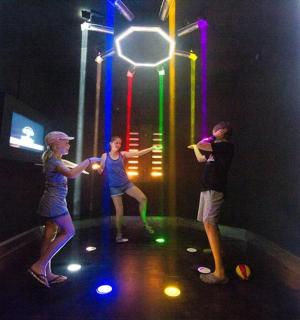 a group of people playing a game in an indoor gym