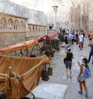 a group of people walking in an alley in a building
