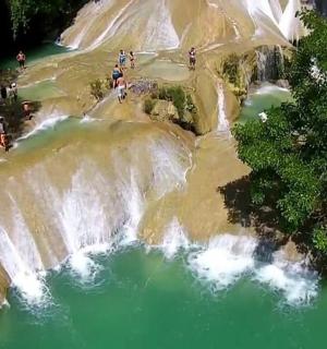an aerial view of a waterfall in a river