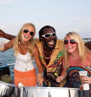 a group of three people standing on a boat