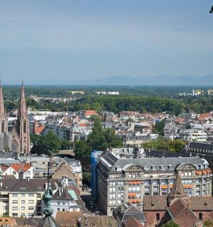 an aerial view of a city with a church