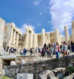 a group of people standing in front of a building