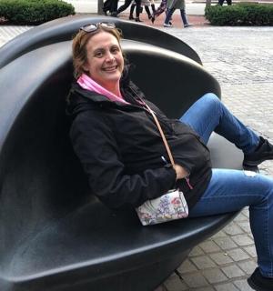 a woman is sitting in a black inflatable
