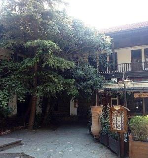 a building with a tree in front of it