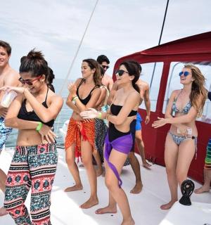 a group of people standing on a boat