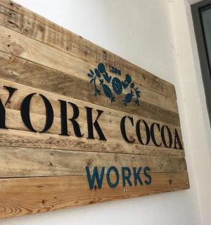 a sign for a k work covenant works on a wall