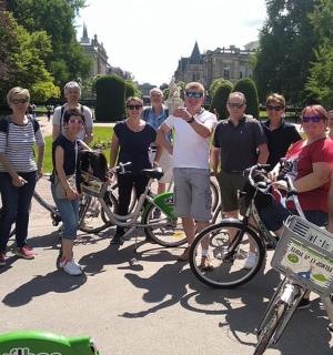 a group of people posing for a picture with their bikes