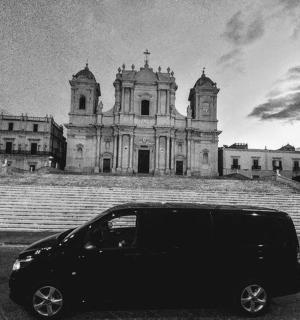 a black van parked in front of a building