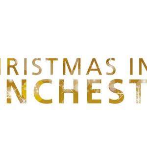 a gold christmas in winchester sign with a star