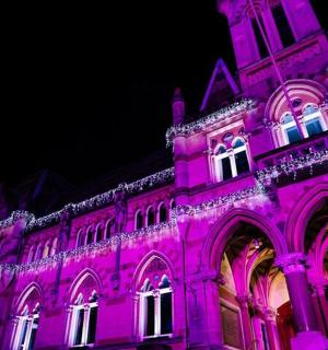 a building that is lit up in purple