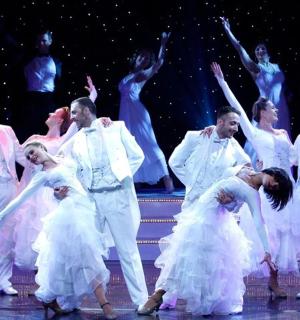 a group of dancers dancing on the stage