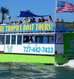 a tour boat in the water with people on it