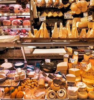 a store filled with lots of different types of cheese