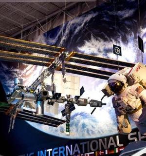 a depiction of an astronaut and a space station