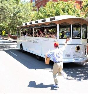 a man running towards a bus full of people