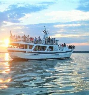 a group of people on a boat in the water