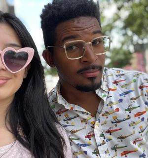 a man and a woman wearing heart shaped sunglasses
