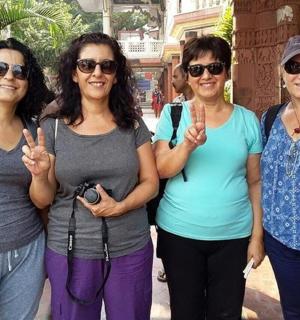 a group of women giving the peace sign