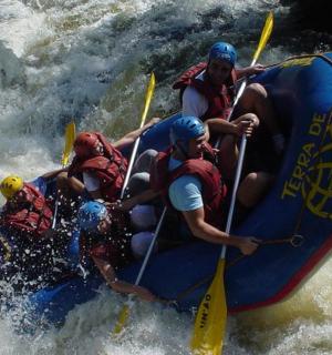 a group of people on a raft in the water
