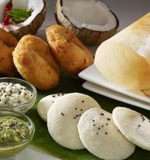 a table with bread and other foods on it