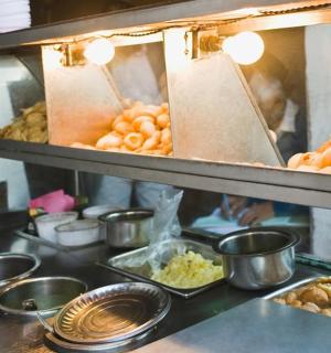 a kitchen with a bunch of food on a counter