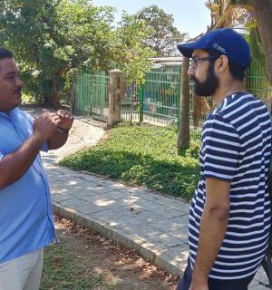two men are standing next to each other